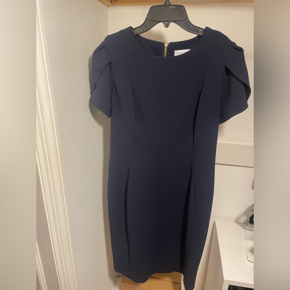 Used Calvin Klein Dress in color Navy Blue. Size 12 petite.